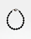 Black bracelet with beads.