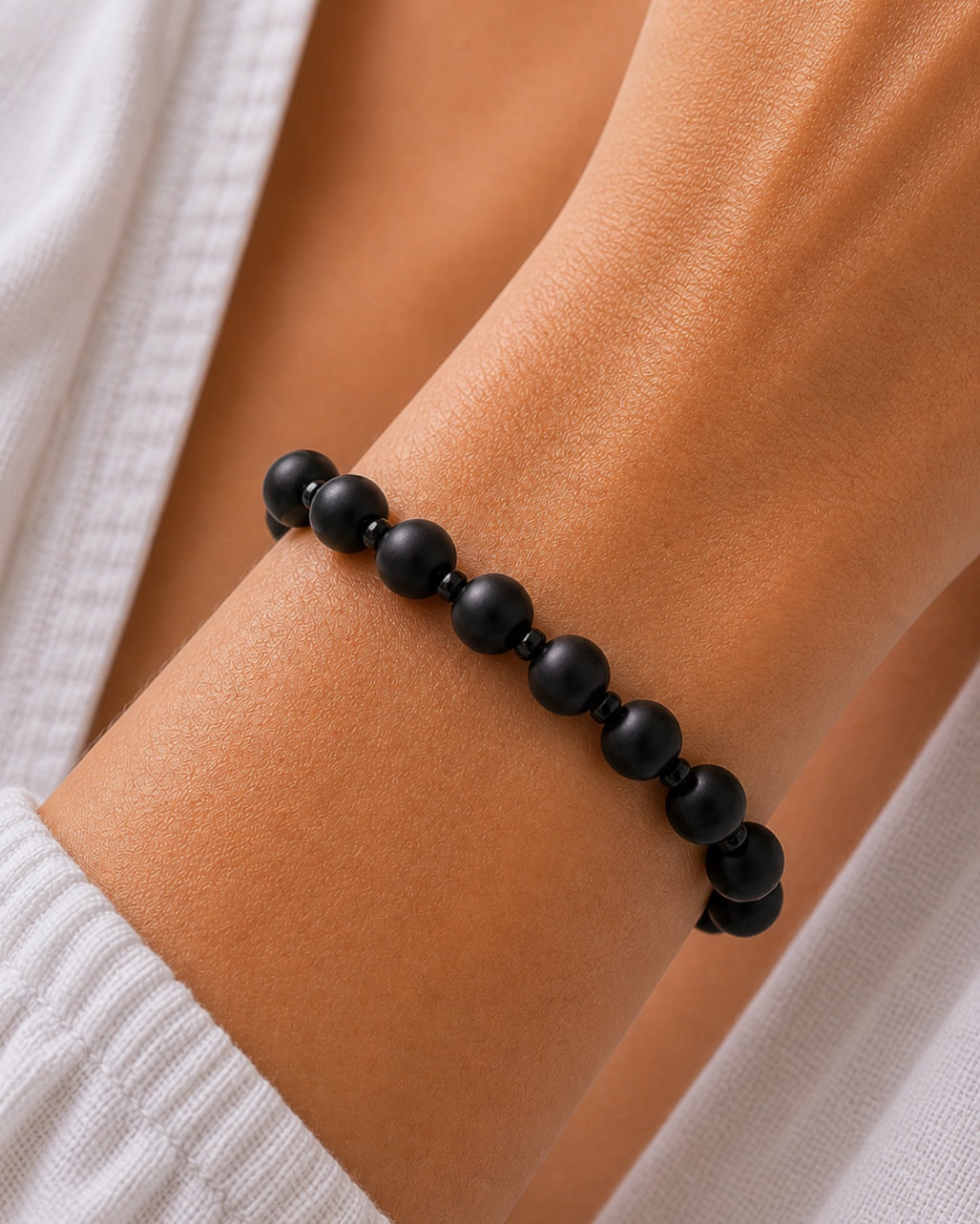 Black bracelet with beads.