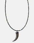 Black necklace with a horn pendant