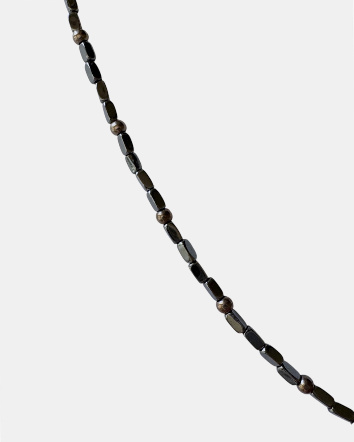 Black necklace with a horn pendant