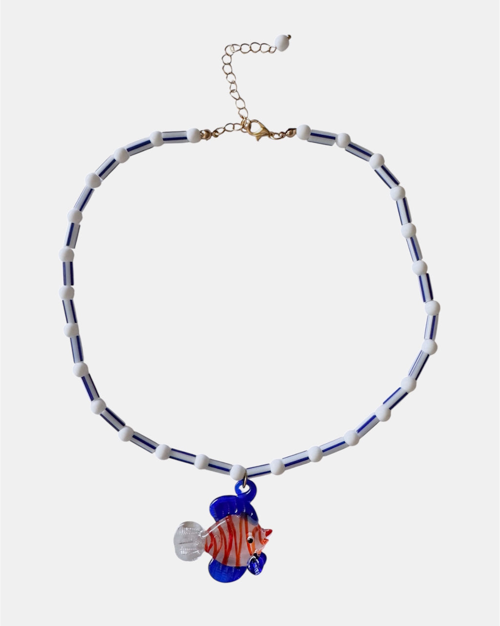 blue and white necklace with glass beads and fish charm, handmade jewelry piece for women and girls
