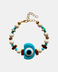 Gold bracelet with turquoise eye and ecru beads