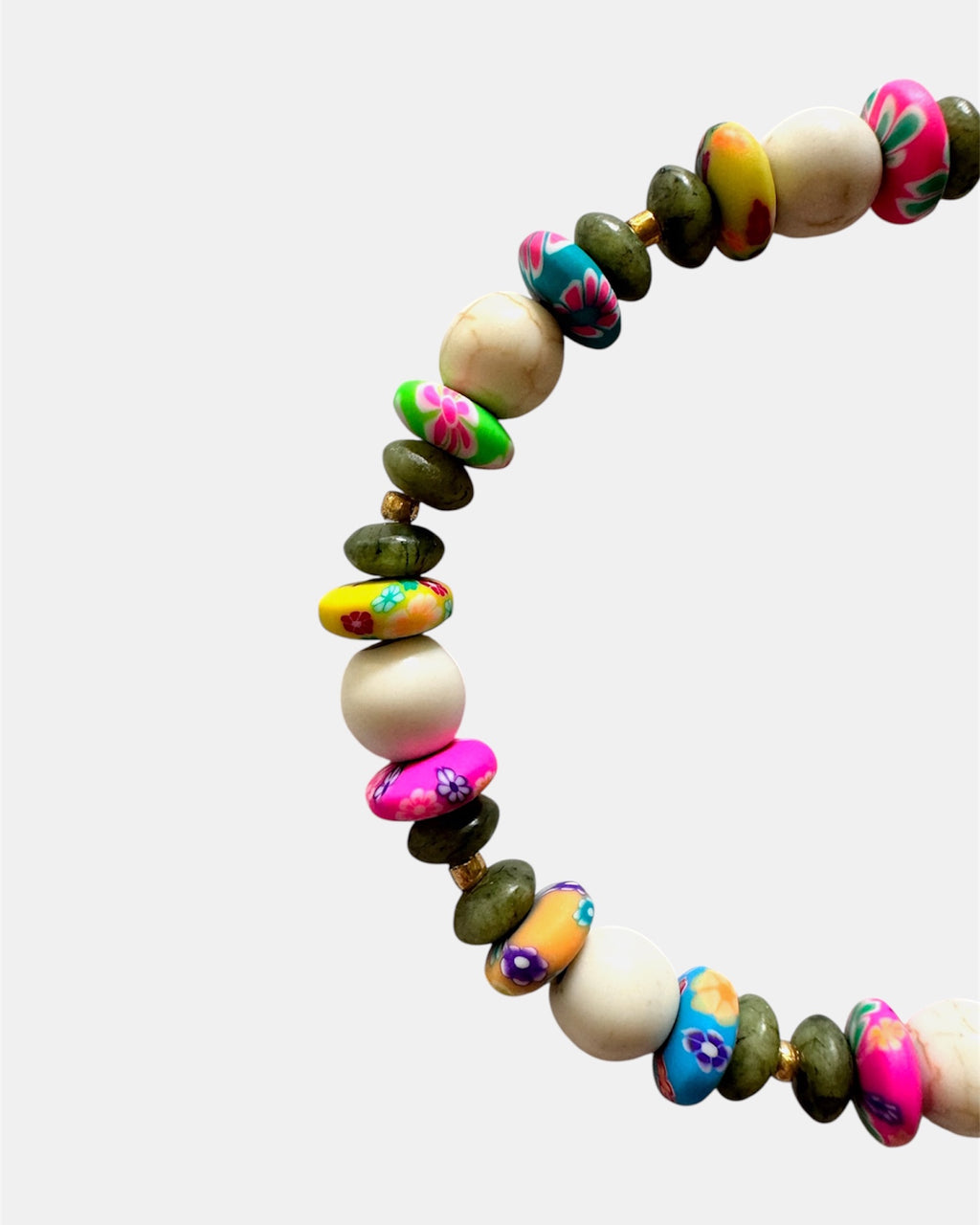 Gold bracelet with ecru and multicolor beads in vibrant boho style
