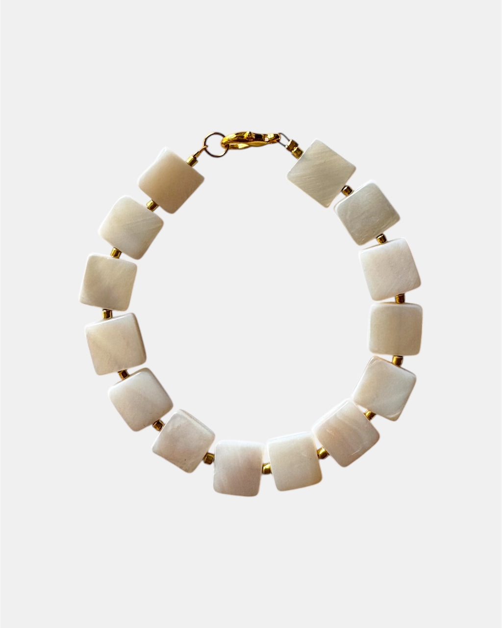 Necklace with square beige beads on a white background