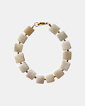 Necklace with square beige beads on a white background