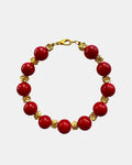 Gold bracelet with red beads in elegant minimalist style