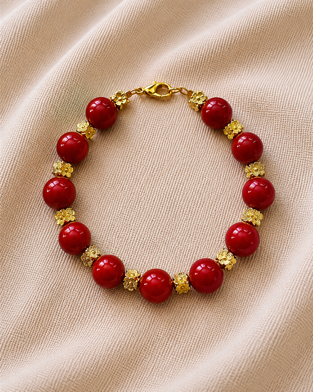 Gold bracelet with red beads in elegant minimalist style