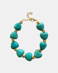 Gold bracelet with turquoise beads and heart charm in elegant boho style