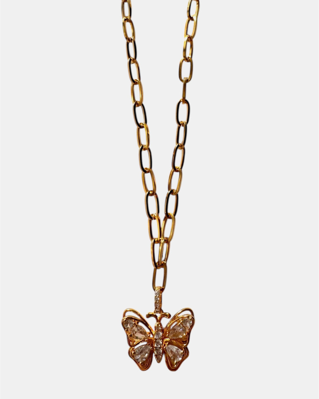 Gold necklace with a butterfly and crystal details