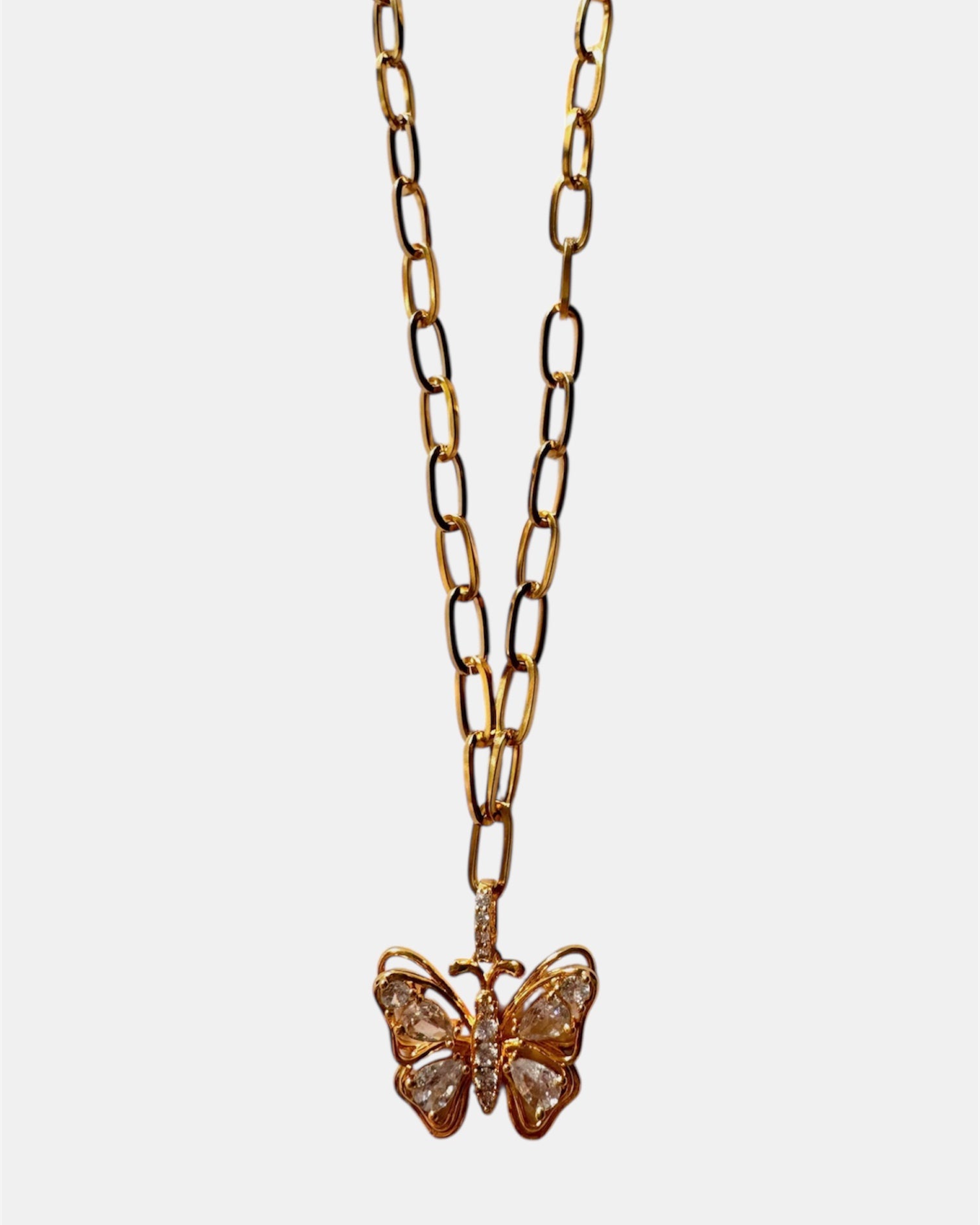 Gold necklace with a butterfly and crystal details