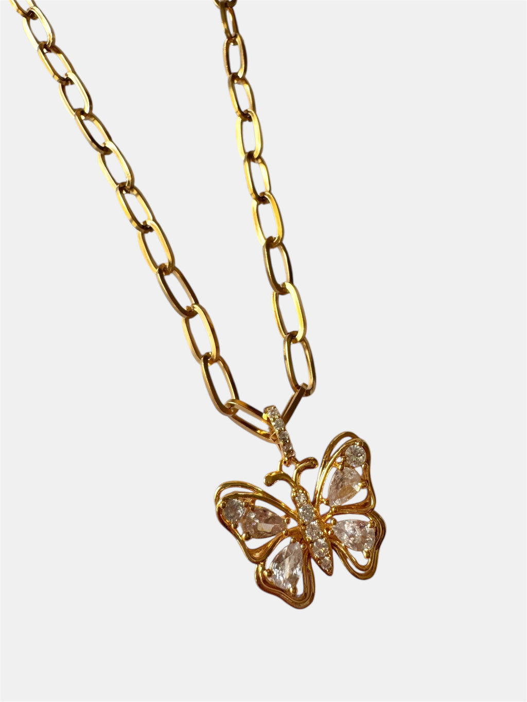 Gold necklace with a butterfly and crystal details