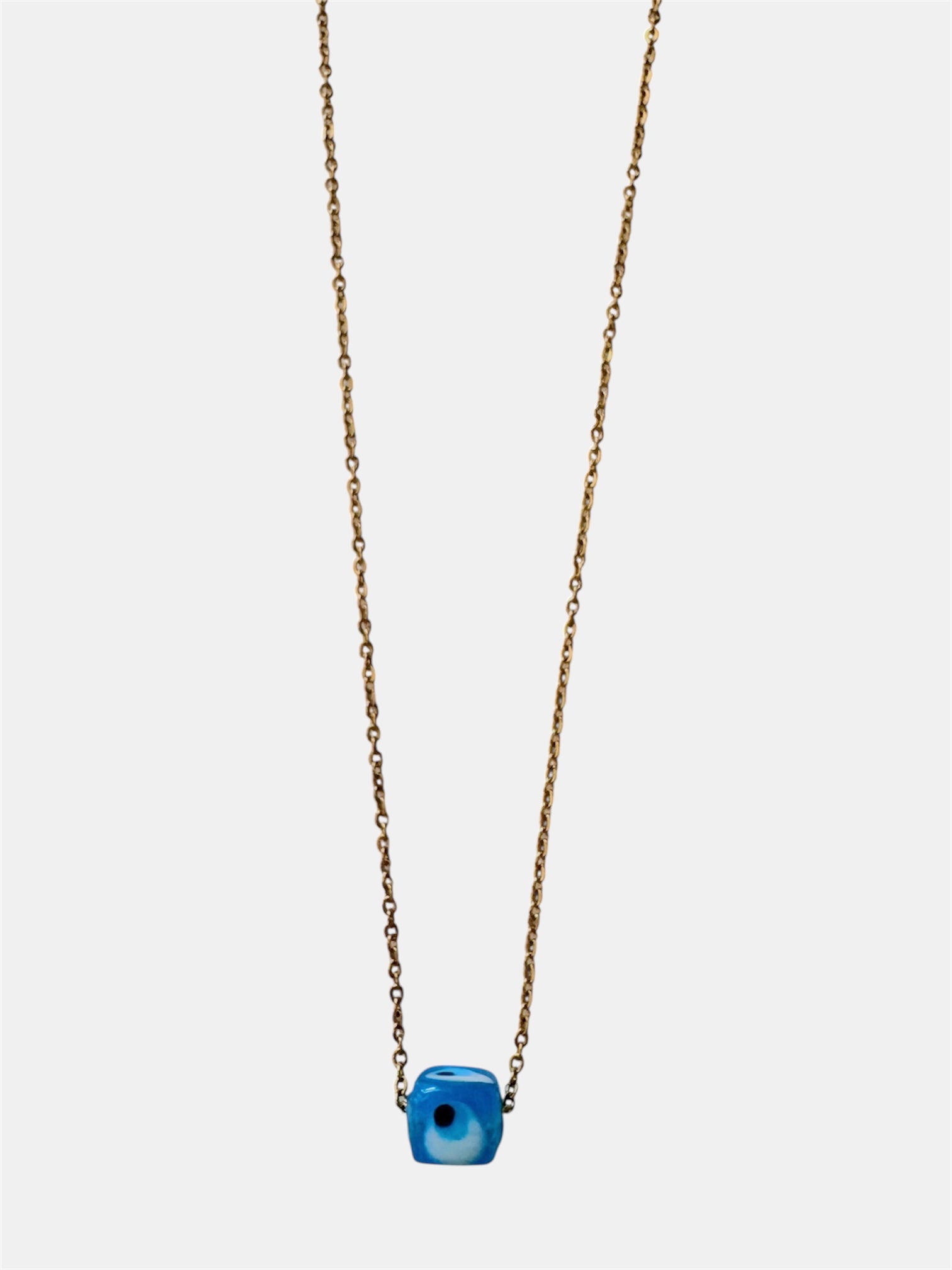 Gold chain necklace with a blue glass evil eye charm
