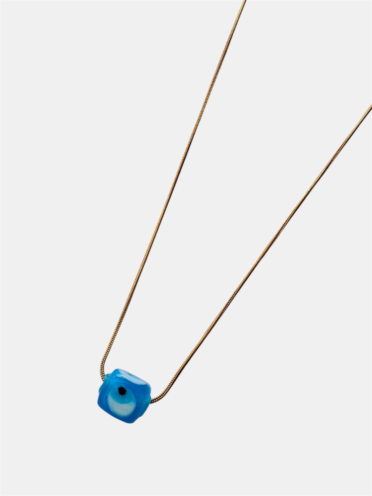 Gold chain necklace with a blue glass evil eye charm