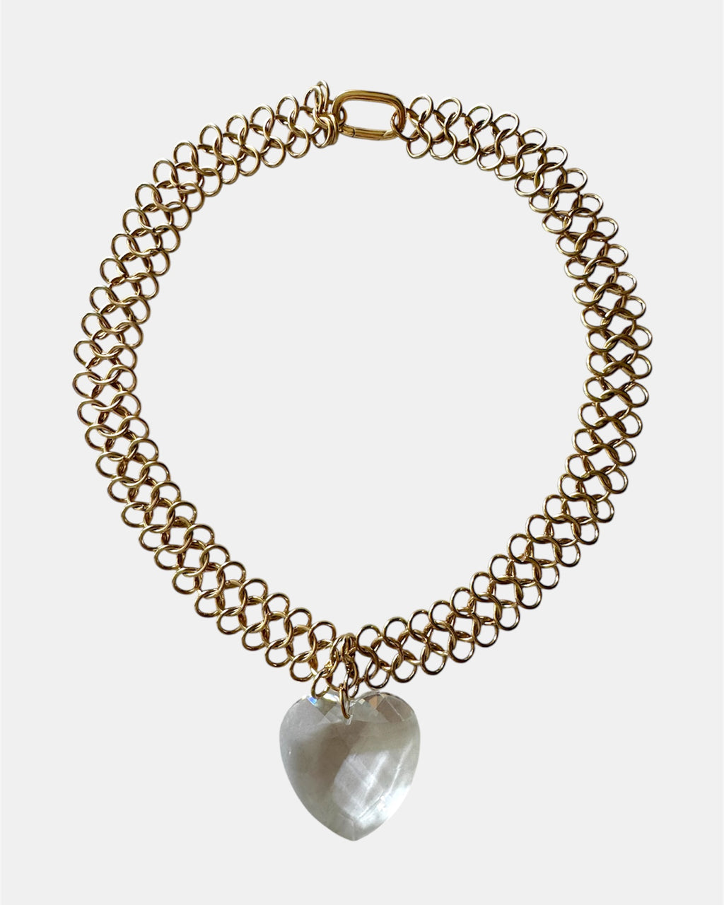 Gold chain necklace with a glass heart pendant