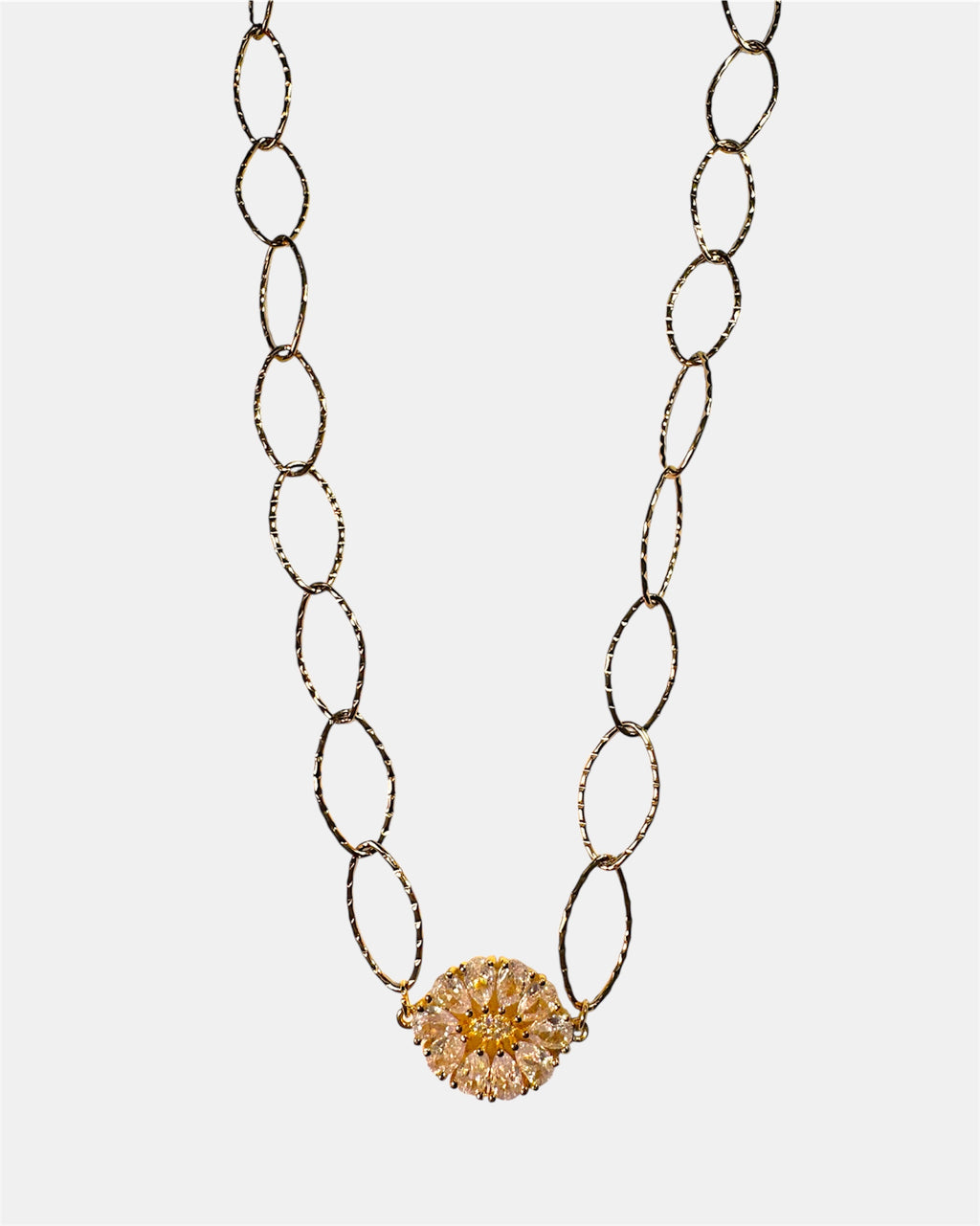 Gold chain necklace with a round charm