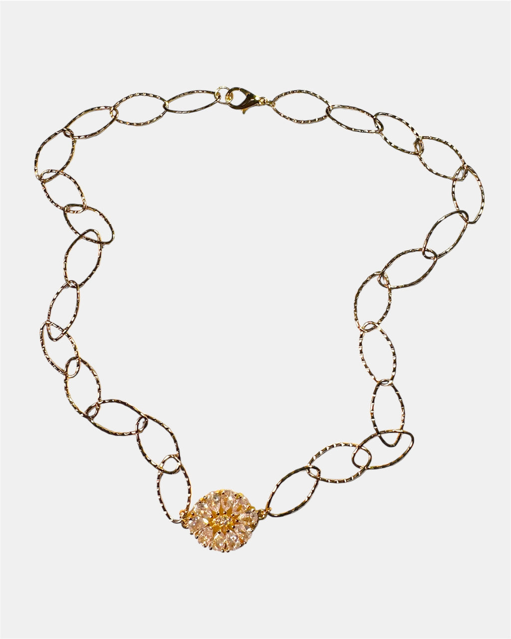 Gold chain necklace with a round charm