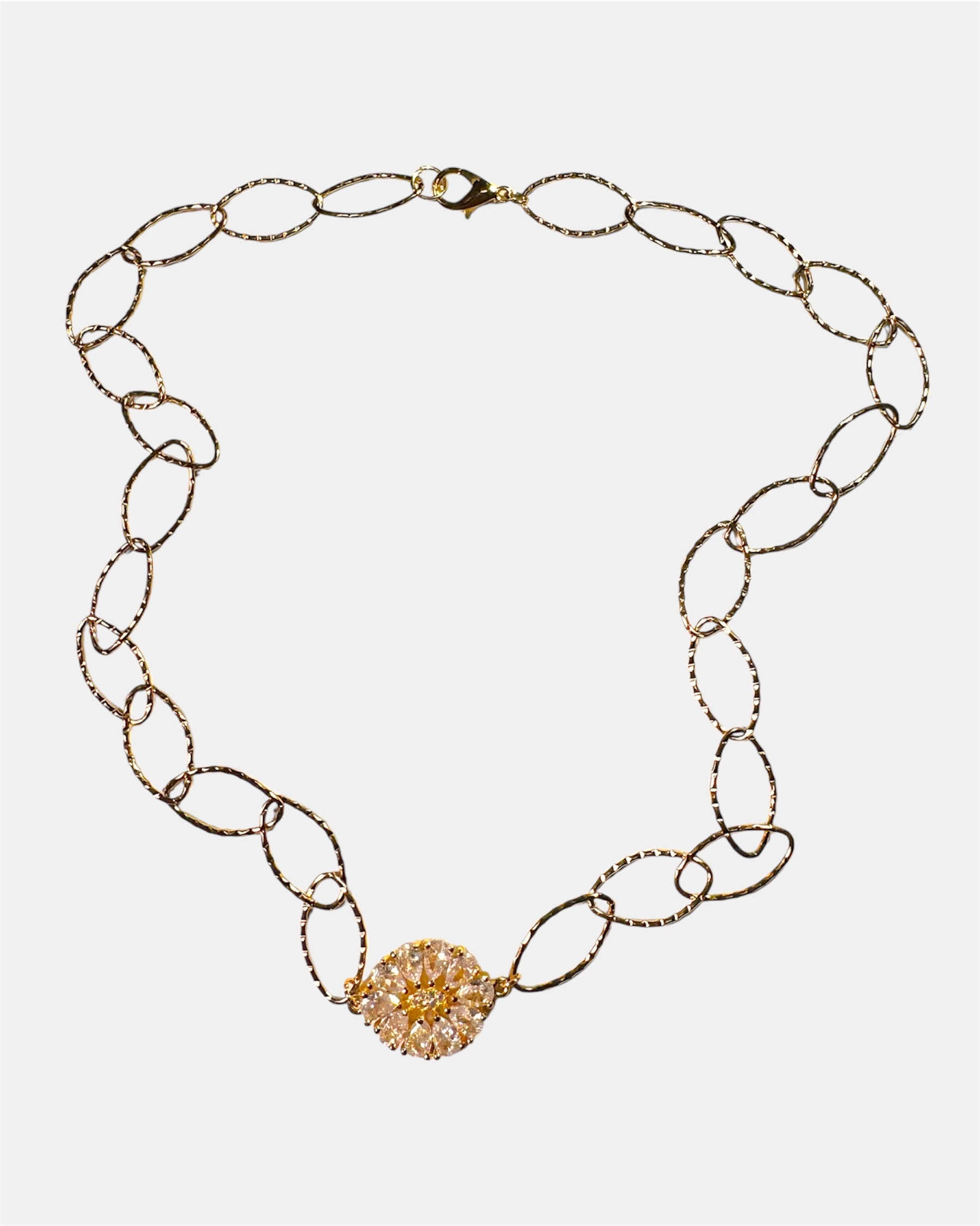 Gold chain necklace with a round charm