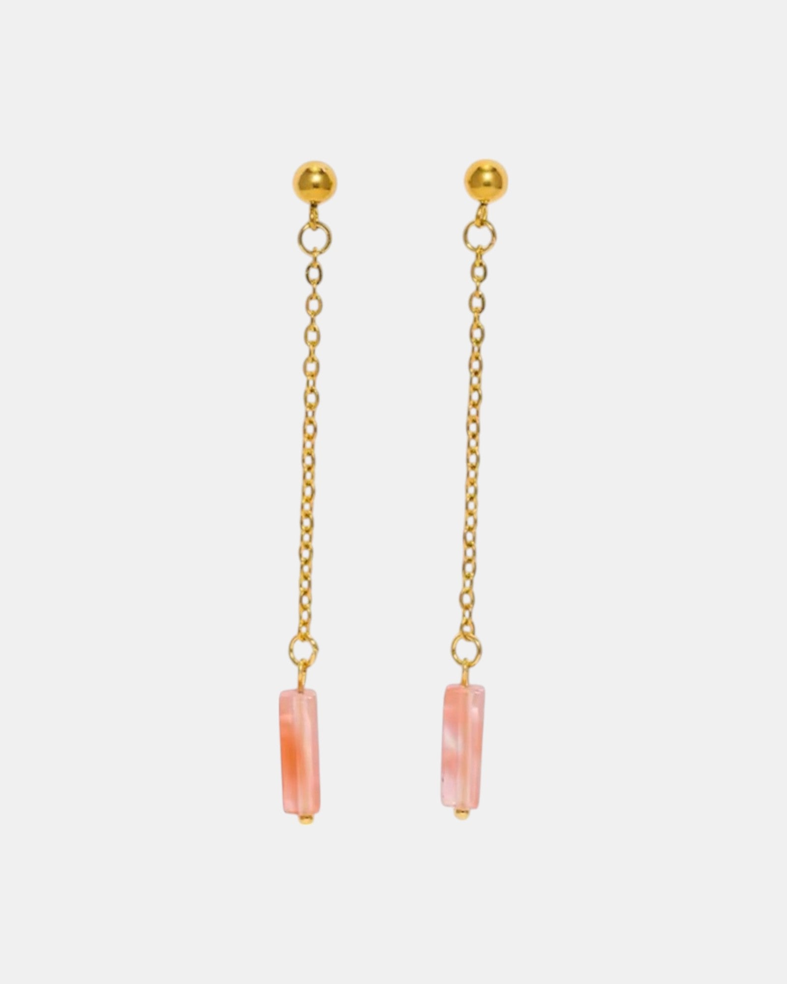 Gold dangle earrings with a pink stone