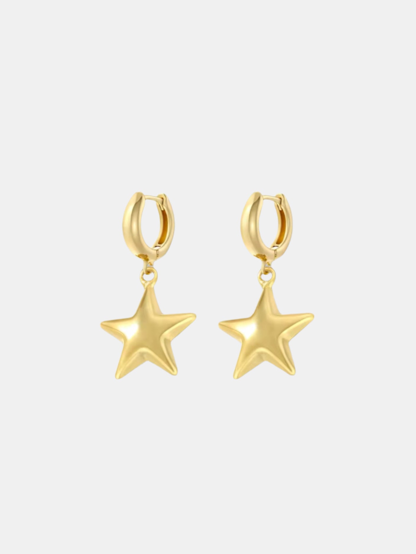 Gold dangle earrings with star design elegant jewelry accessory