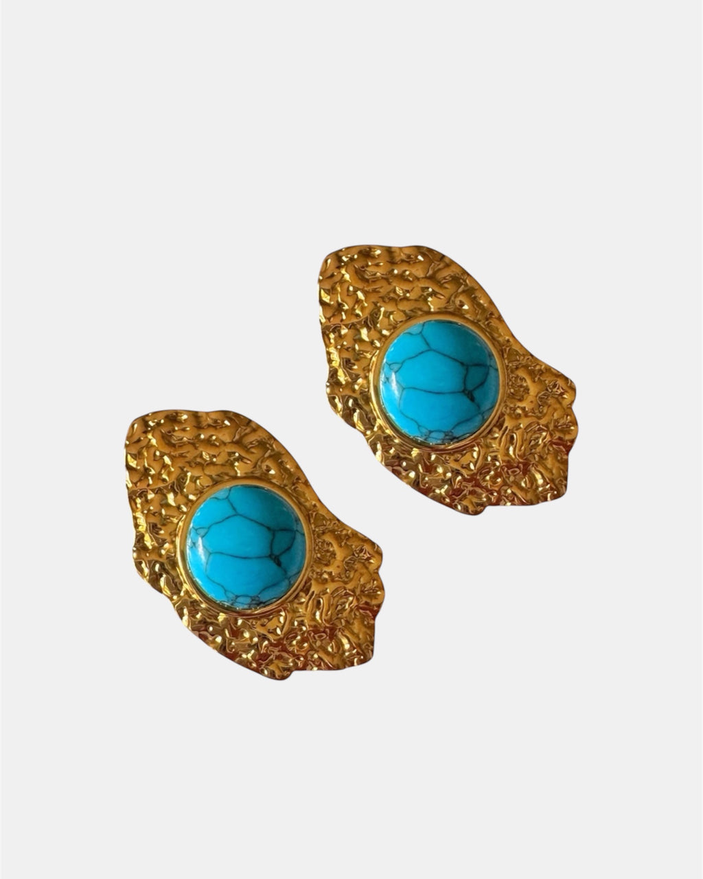Gold dangling earrings with teal stone.