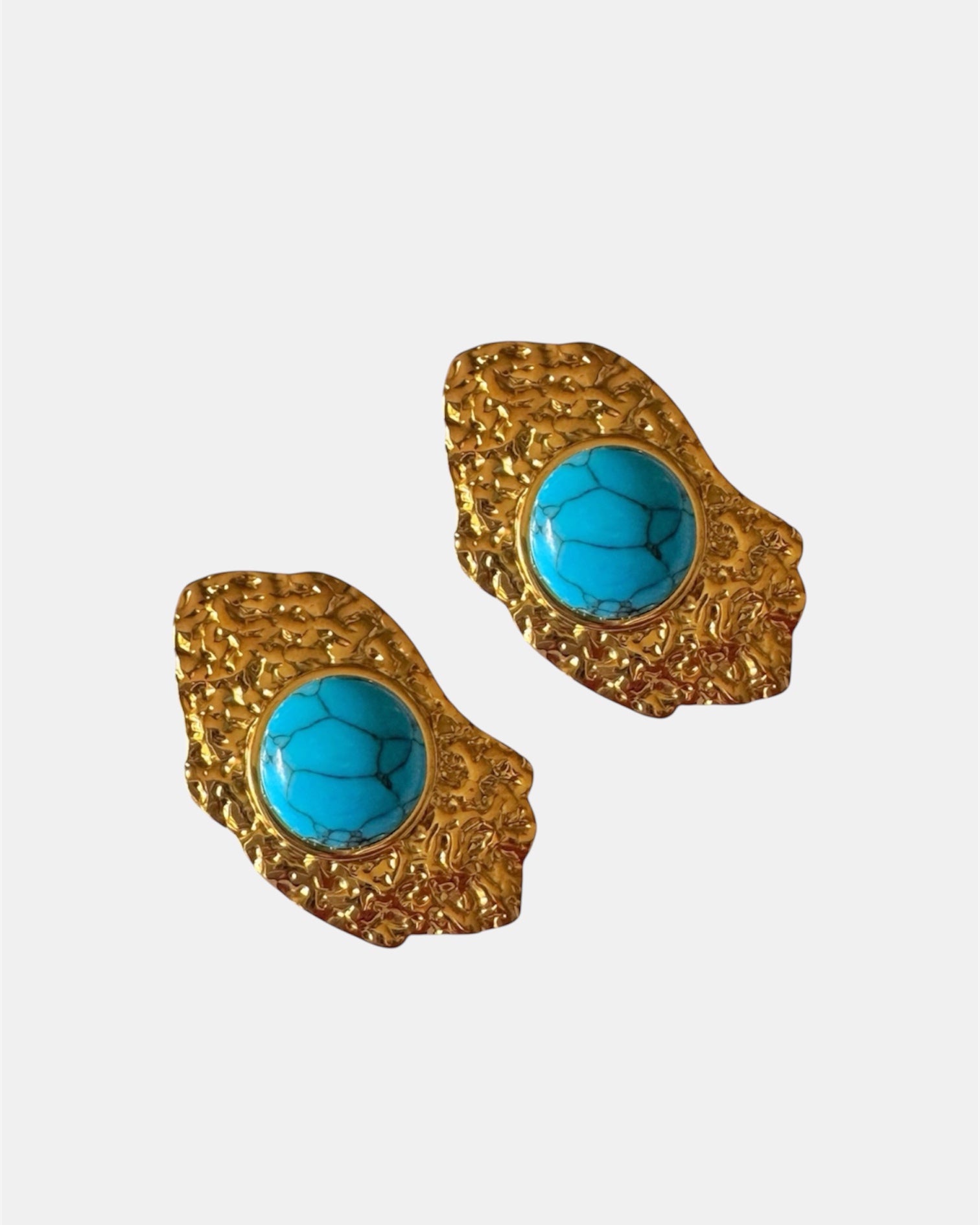 Gold dangling earrings with teal stone.