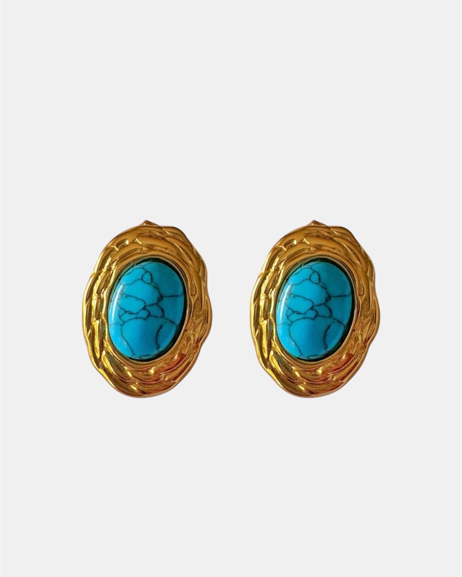 Gold earrings with turquoise stone.