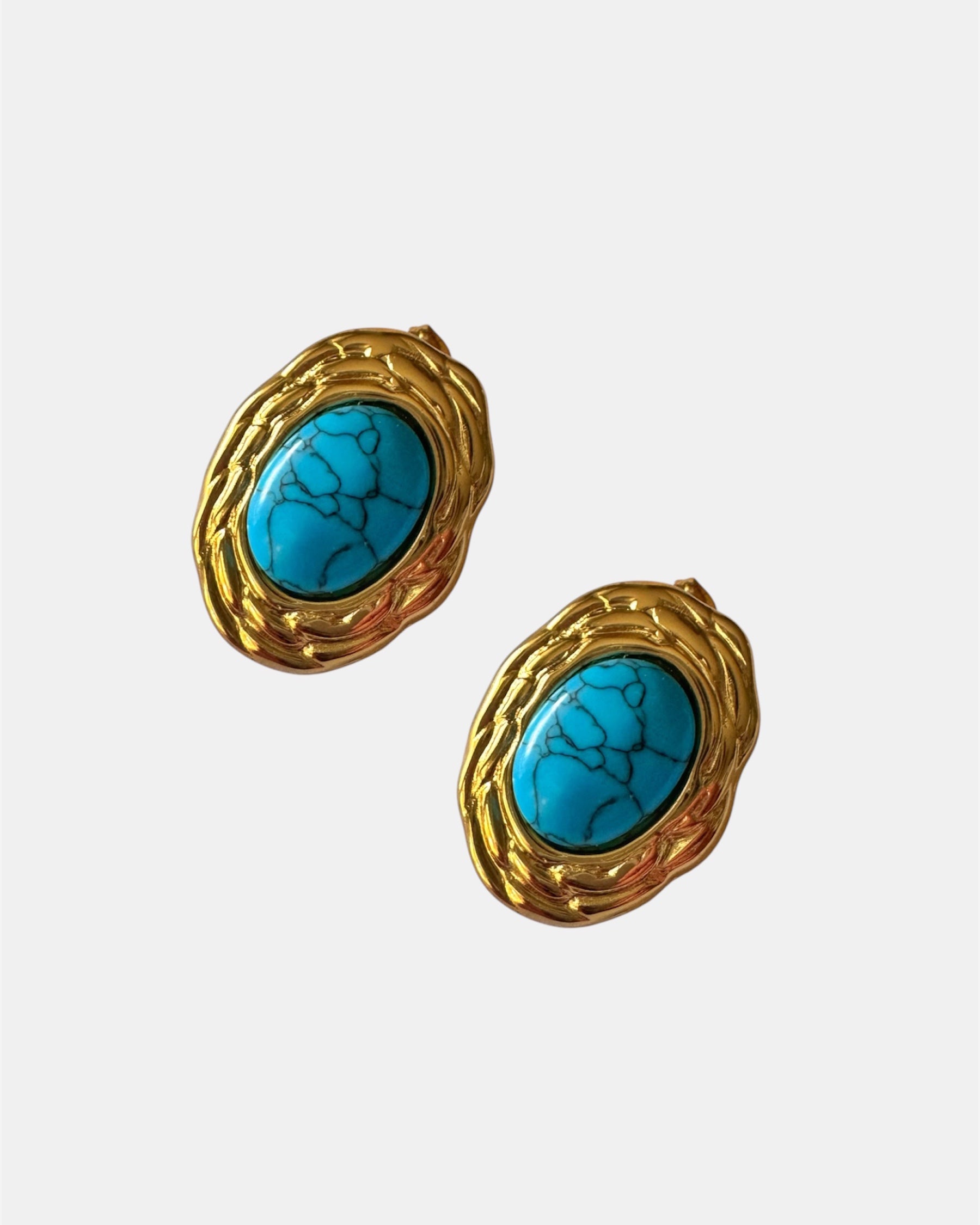 Gold earrings with turquoise stone.