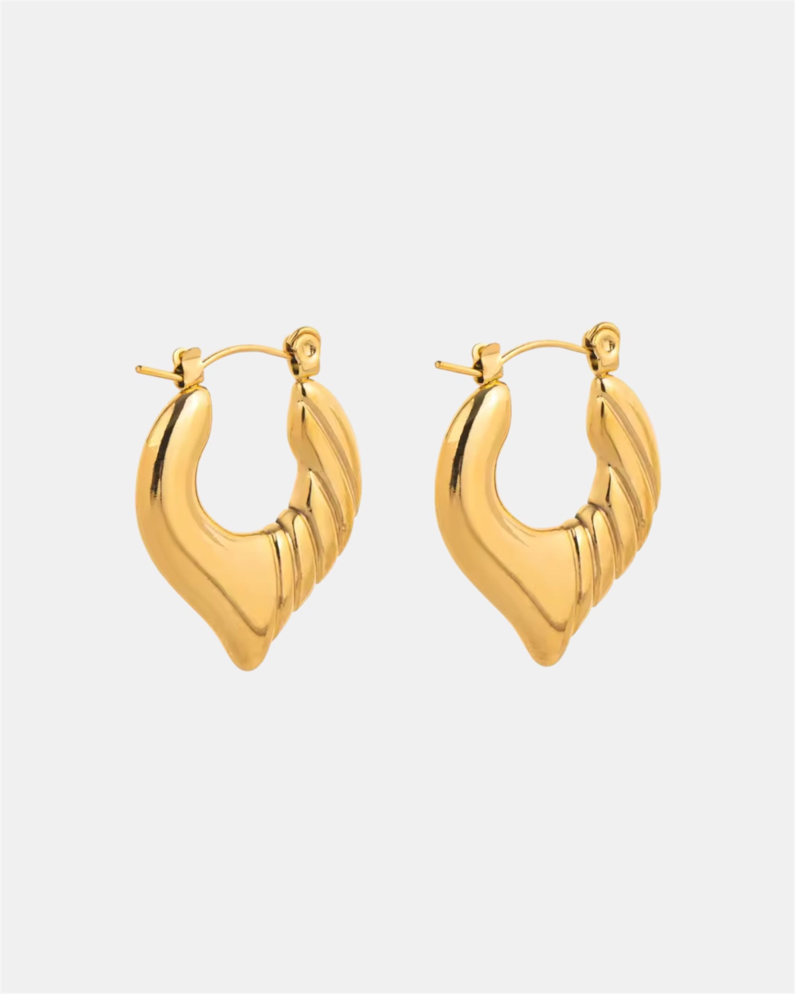 Gold hoop earrings with twisted heart design.