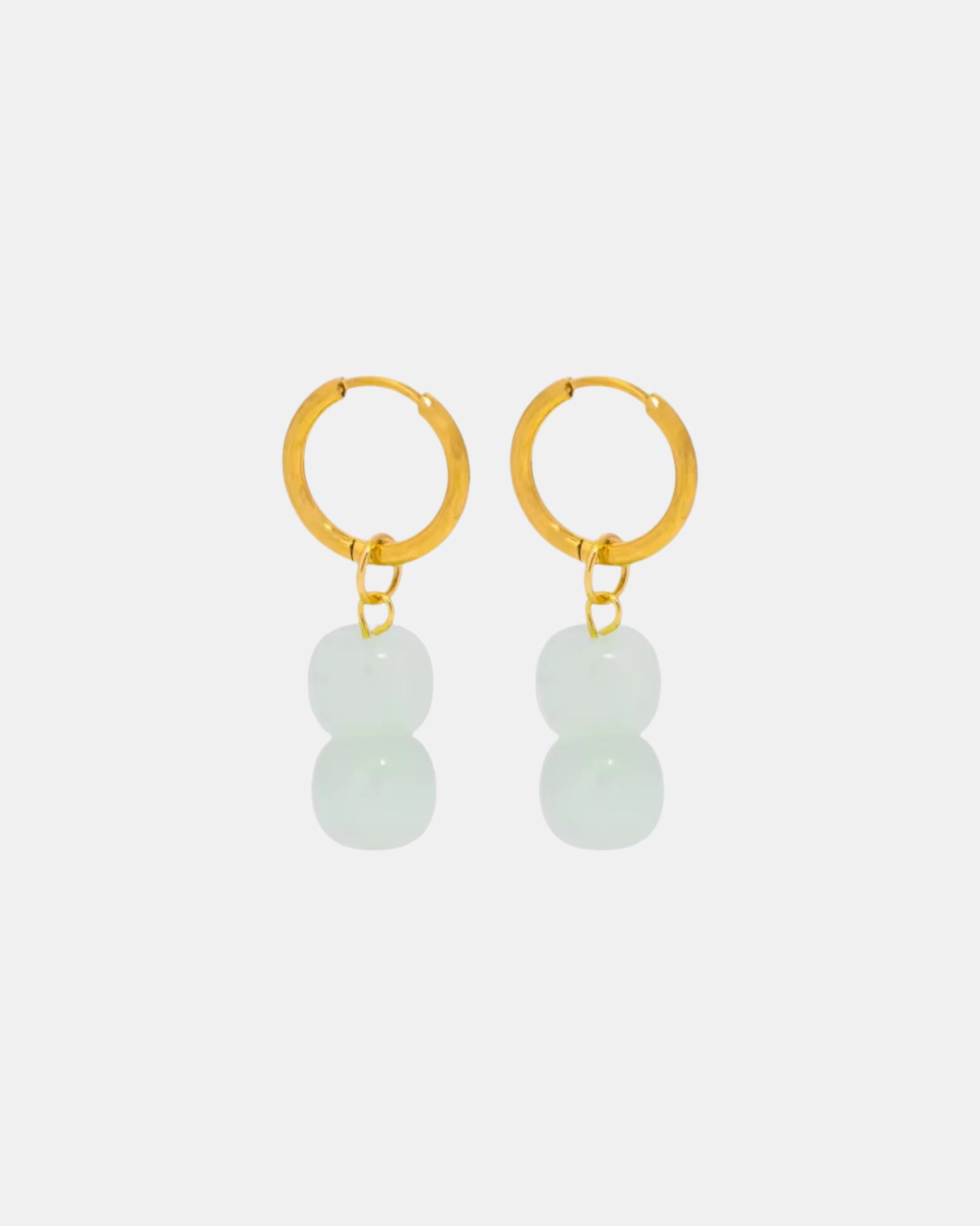 Gold hoop earrings with blue stones