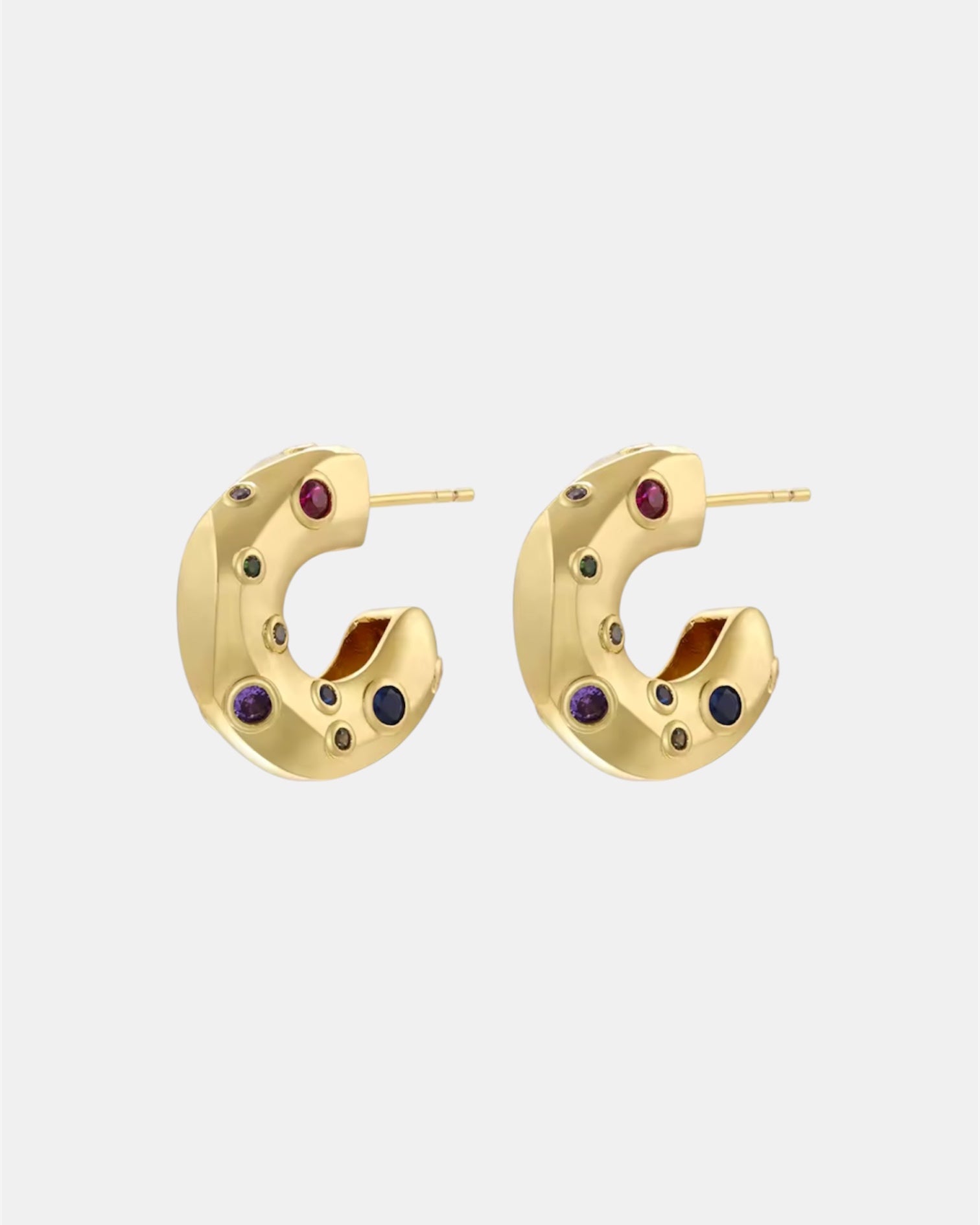 Gold hoop earrings with zircon stones.