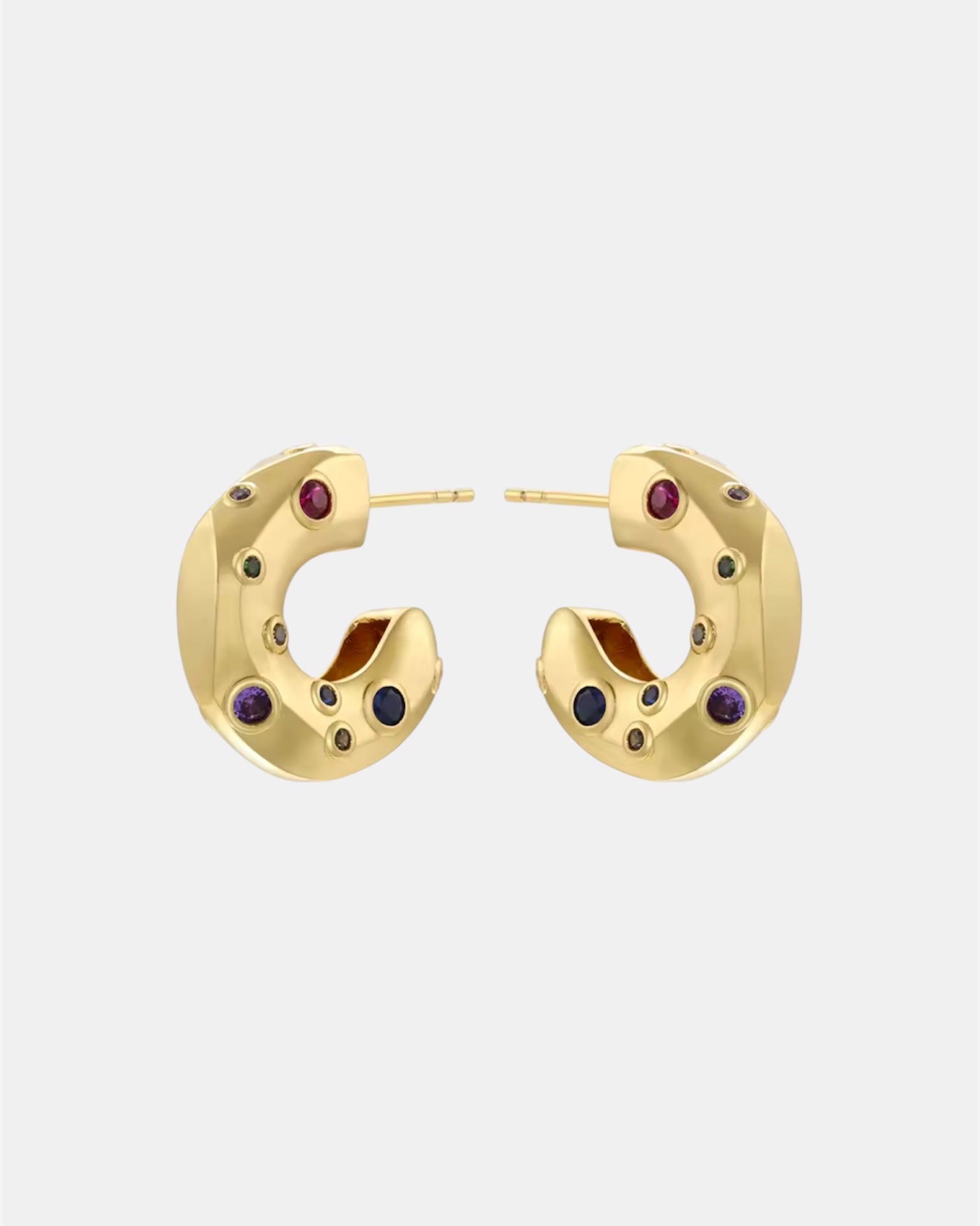 Gold hoop earrings with zircon stones.