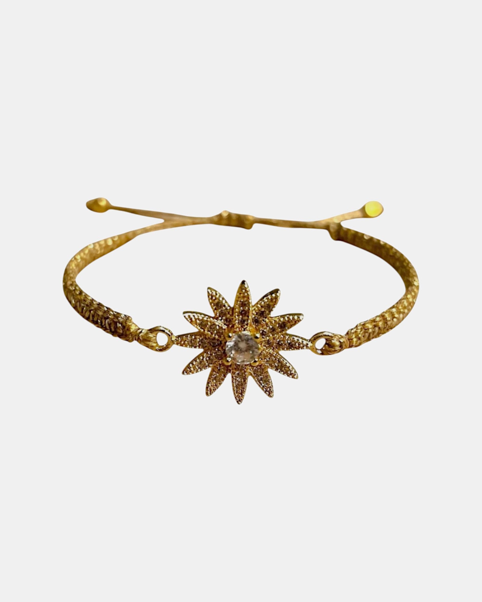 Gold macrame bracelet with daisy charm