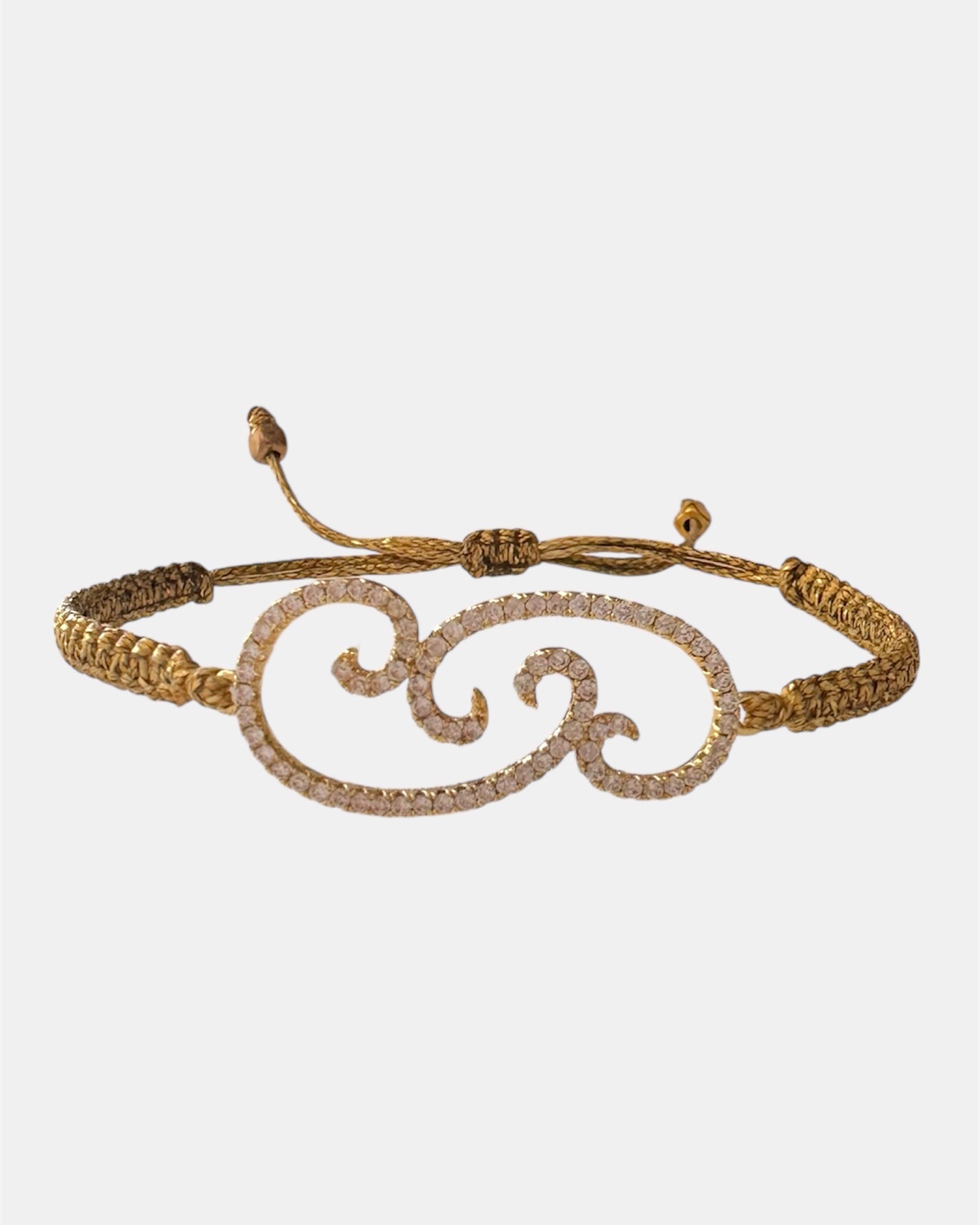 Gold macrame bracelet with flower charm