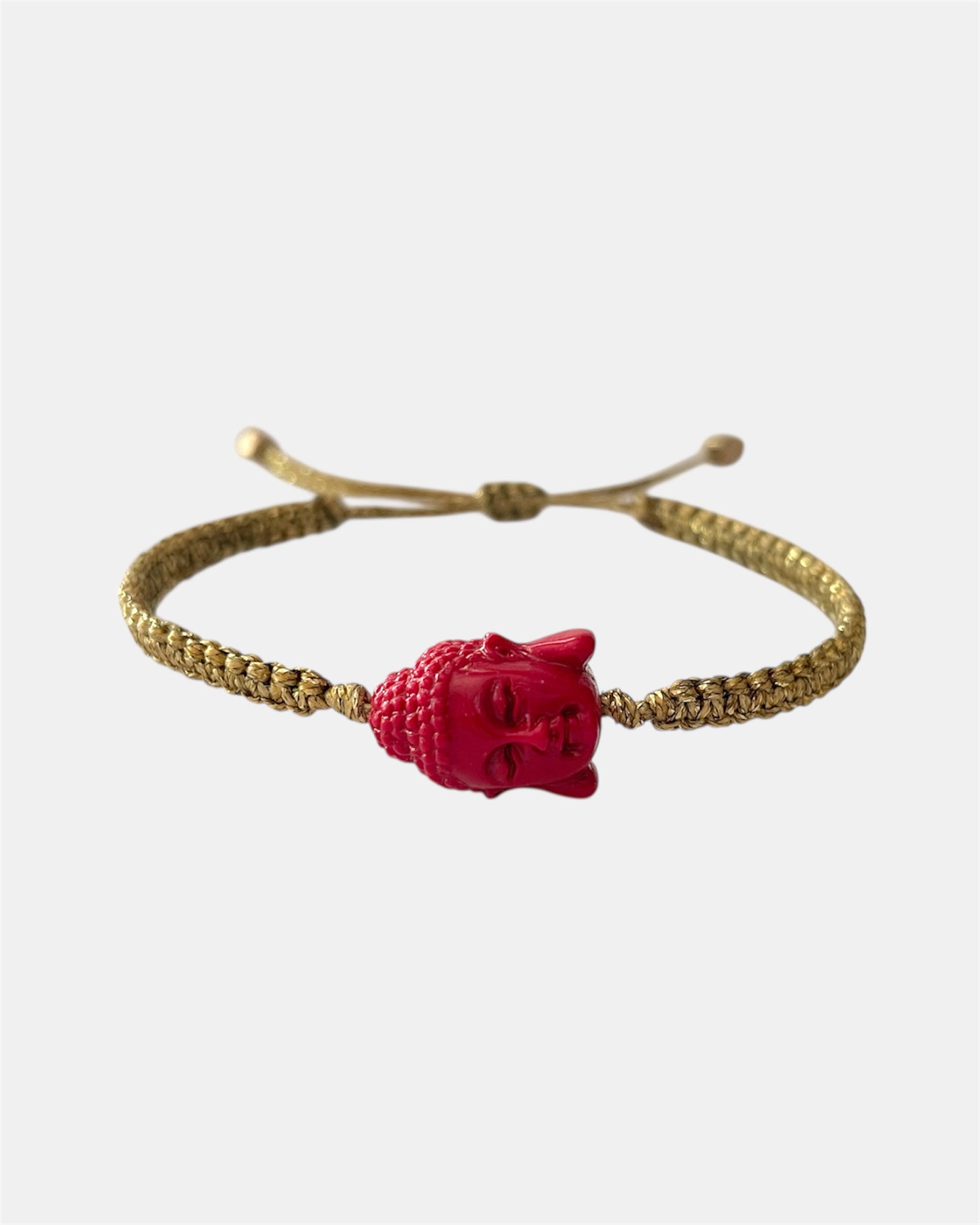 Gold macrame bracelet with red Buddha charm
