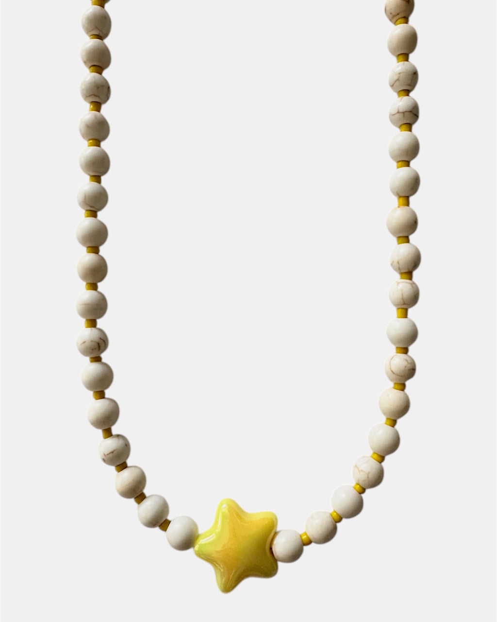 gold necklace with ecru beads and yellow ceramic star charm, elegant jewelry piece for women and girls