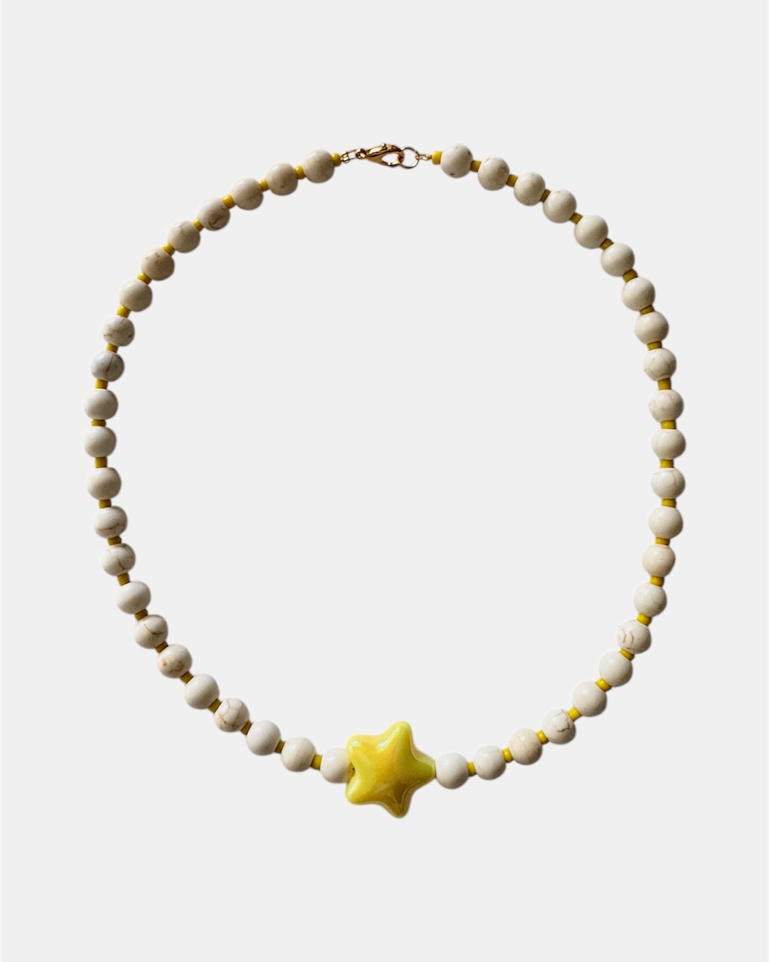 gold necklace with ecru beads and yellow ceramic star charm, elegant jewelry piece for women and girls