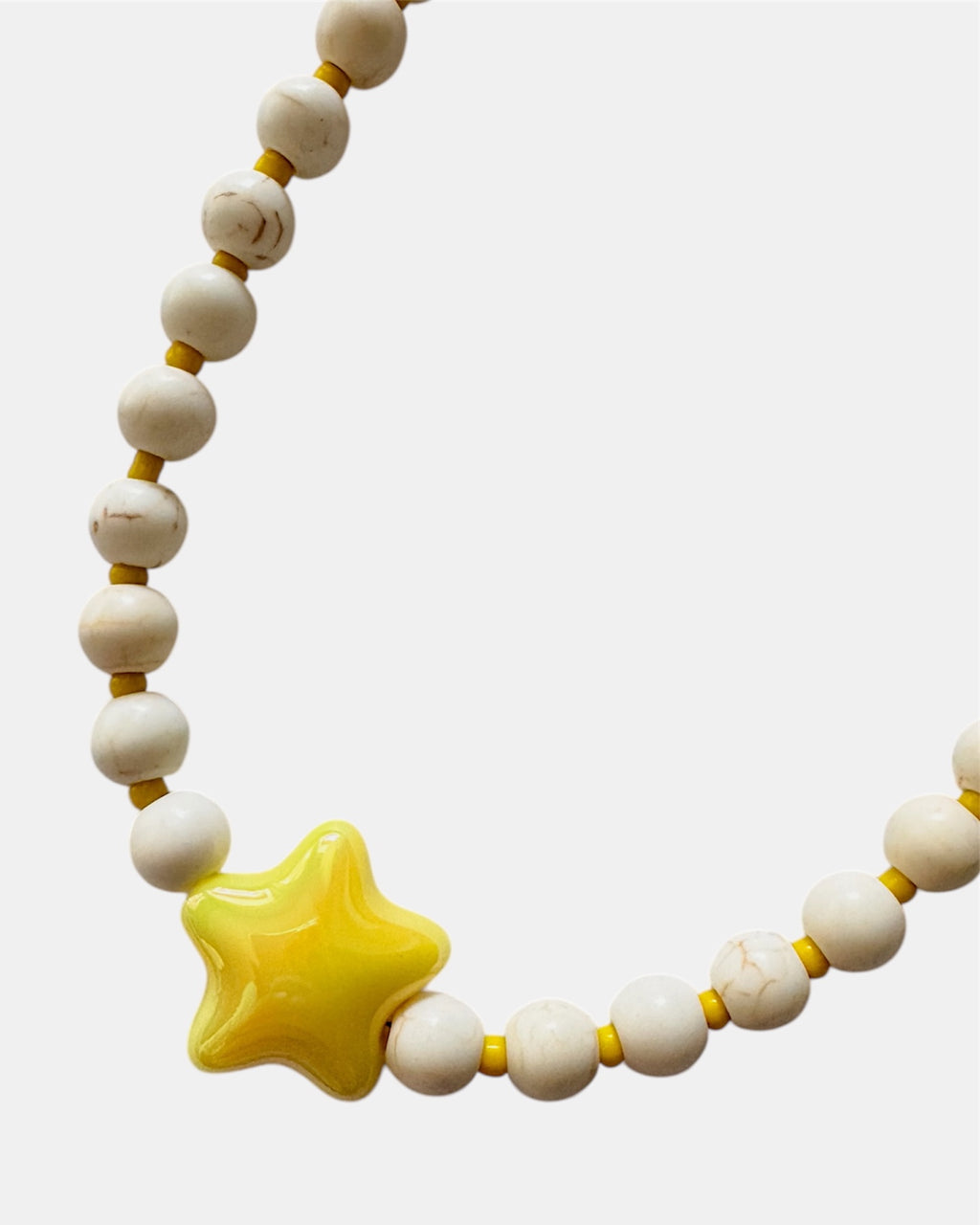 gold necklace with ecru beads and yellow ceramic star charm, elegant jewelry piece for women and girls