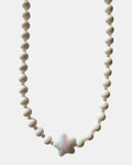 gold necklace with white beads and ceramic star charm, elegant jewelry piece for women and girls