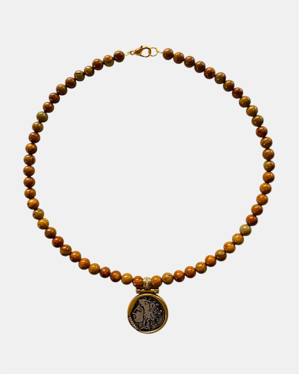 Beaded necklace with a pendant on a white background