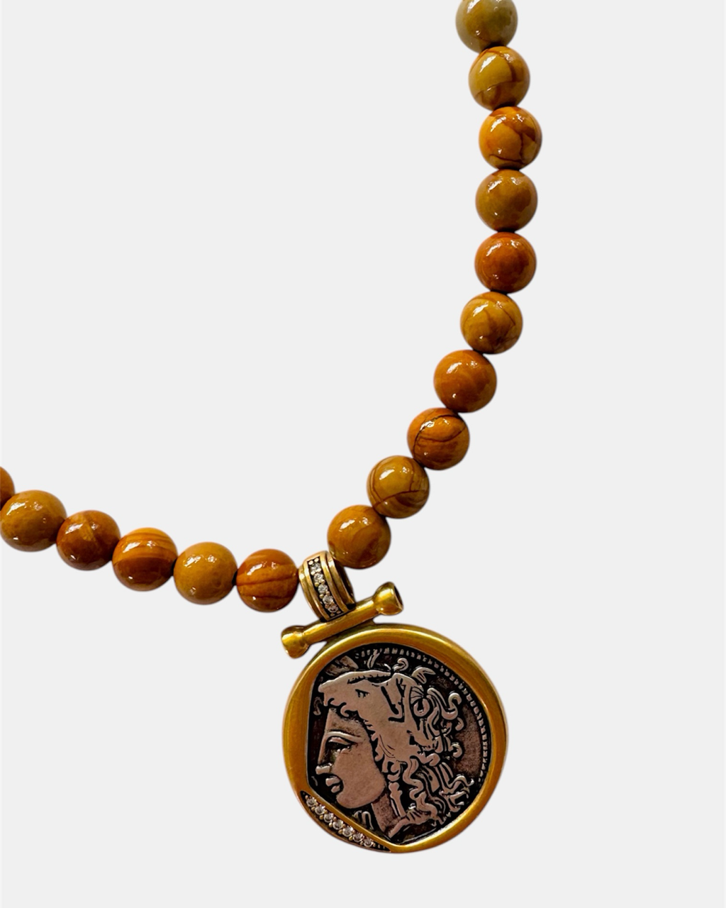 Beaded necklace with a pendant on a white background