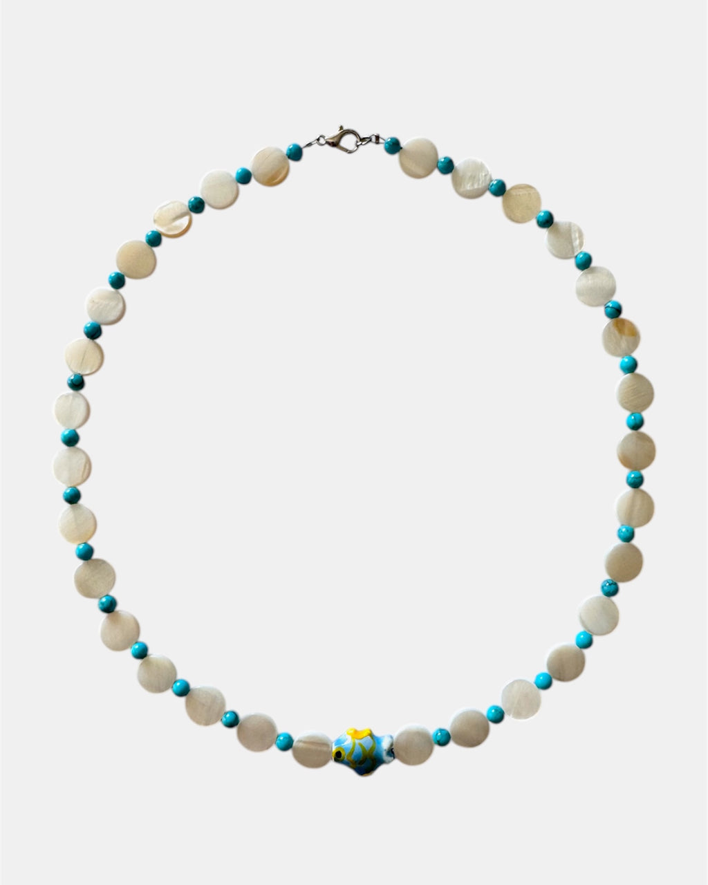 Necklace with white and blue beads on a white background