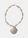 Gold necklace with ivory beads and natural shell