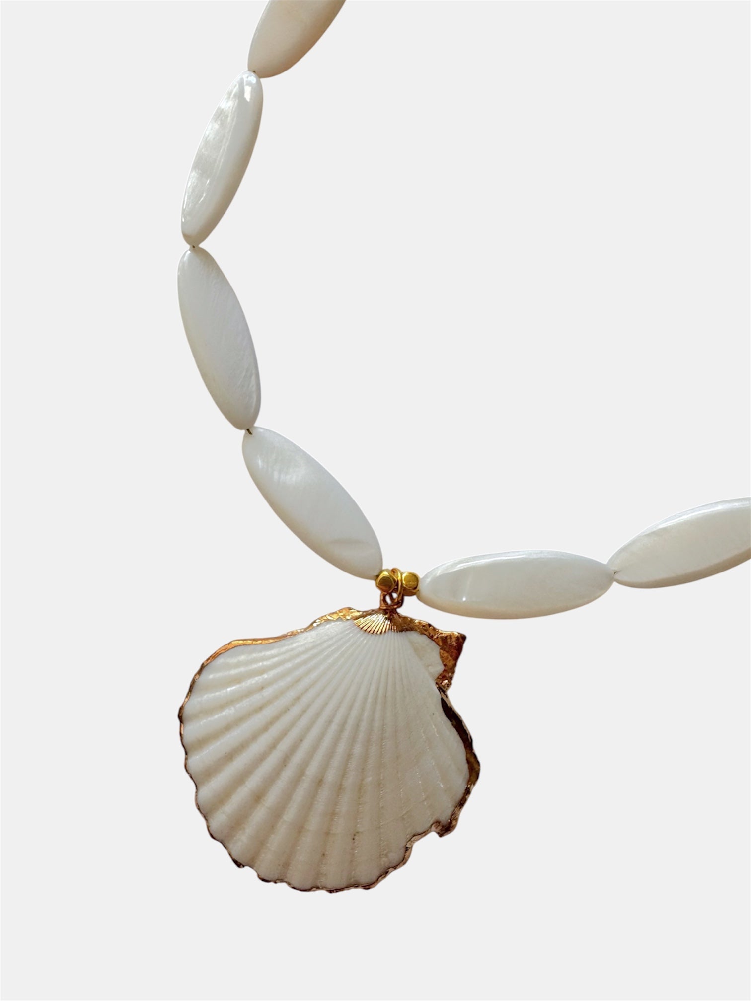 Gold necklace with ivory beads and natural shell