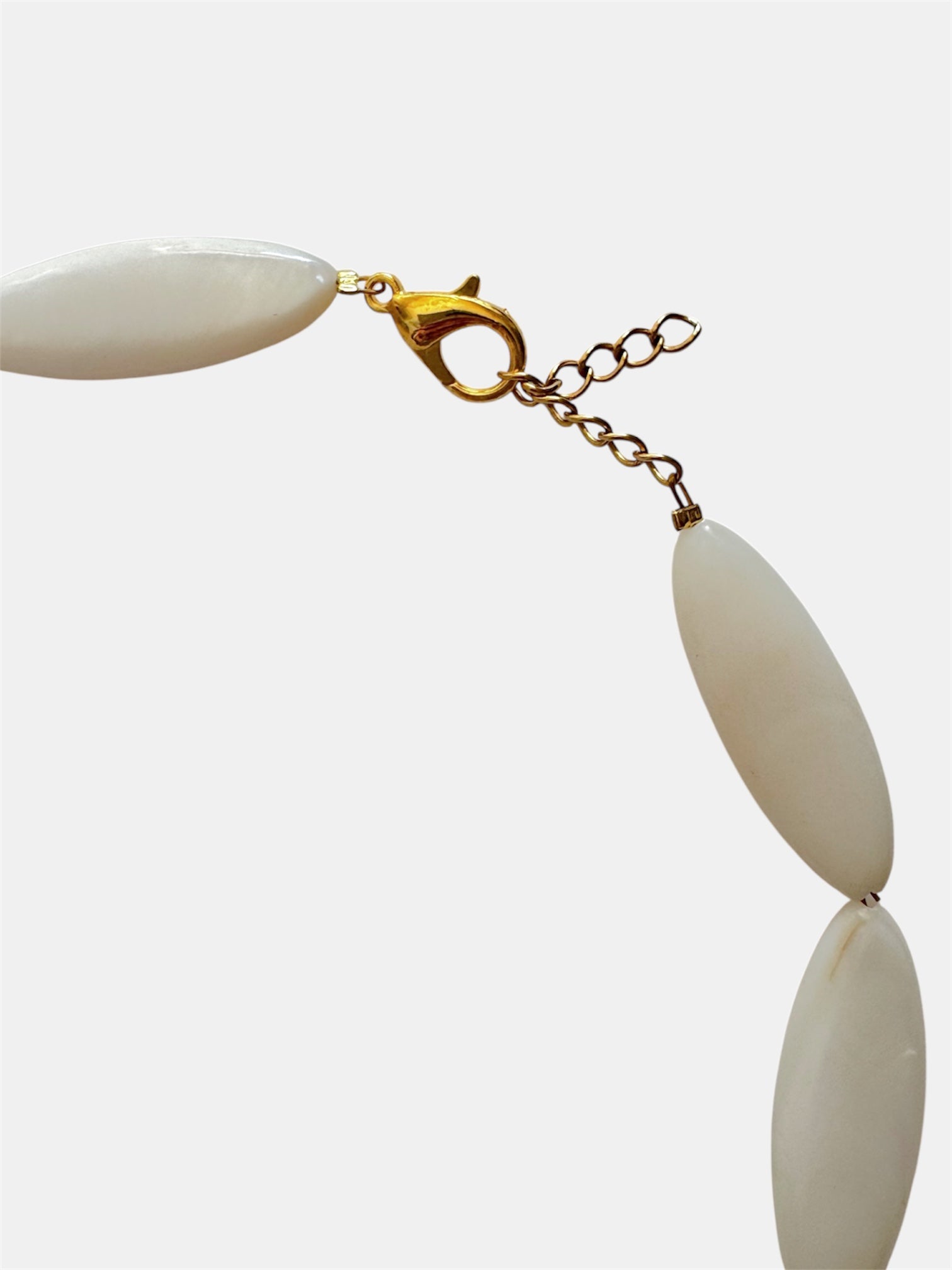 Gold necklace with ivory beads and natural shell