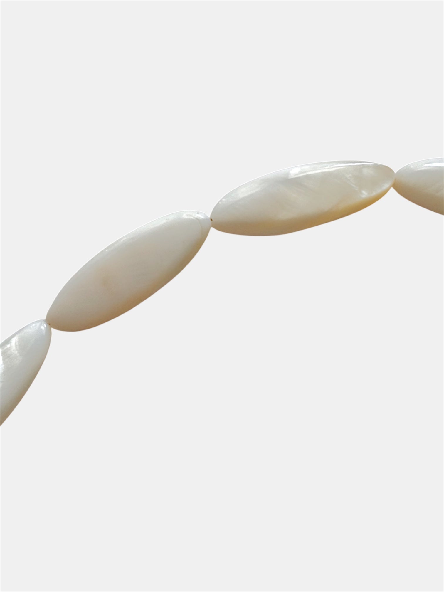 Gold necklace with ivory beads and natural shell