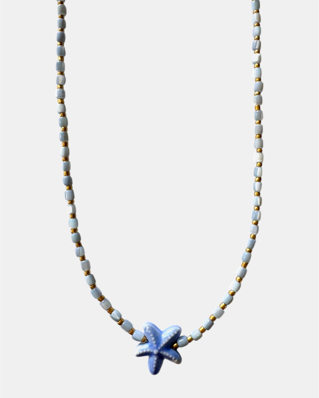 Necklace with a starfish pendant on a white background