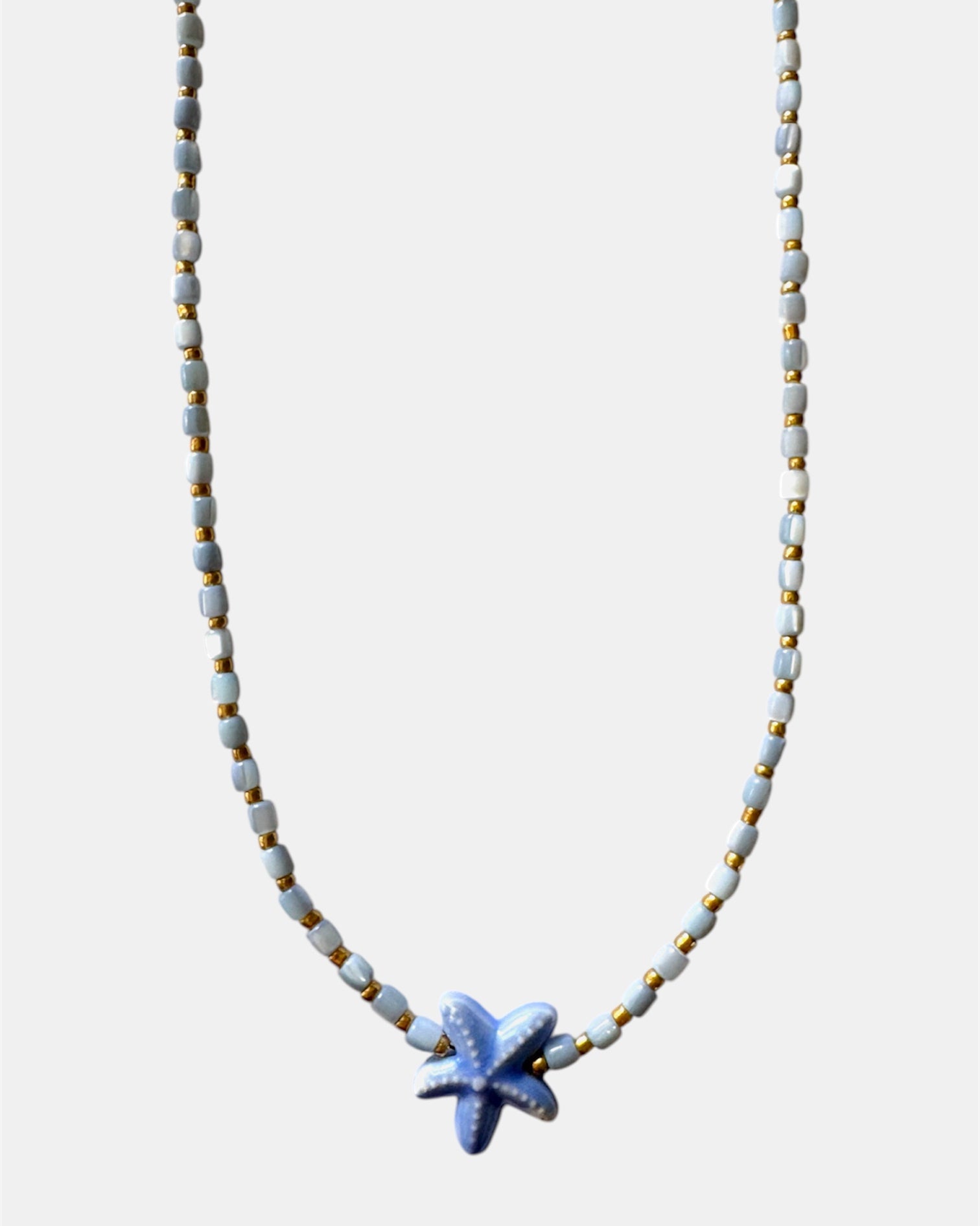 Necklace with a starfish pendant on a white background