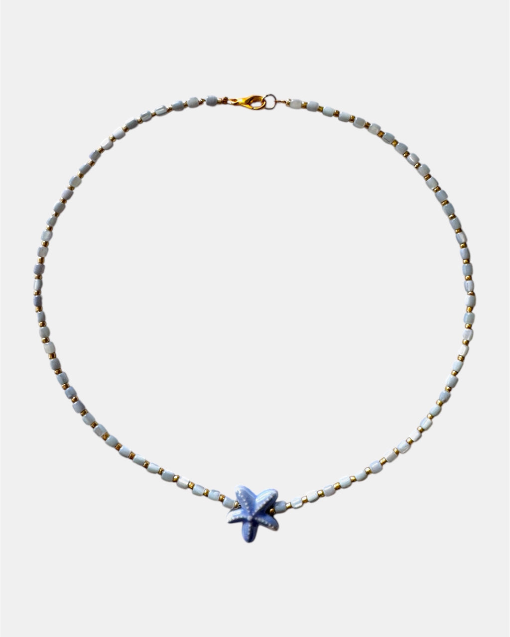 Necklace with a starfish pendant on a white background