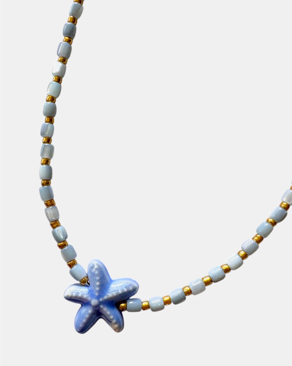 Necklace with a starfish pendant on a white background
