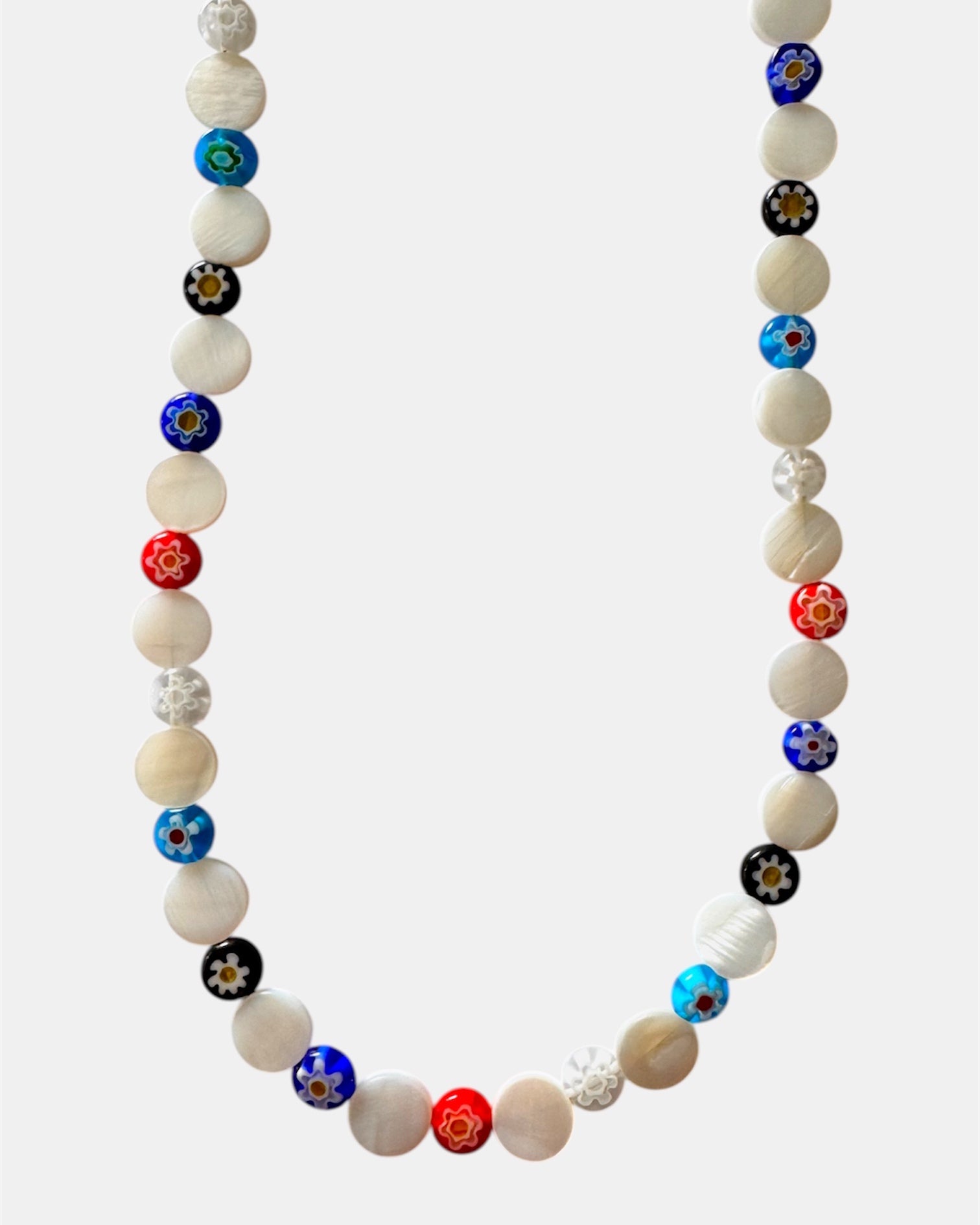 Necklace with multicolored beads on a white background